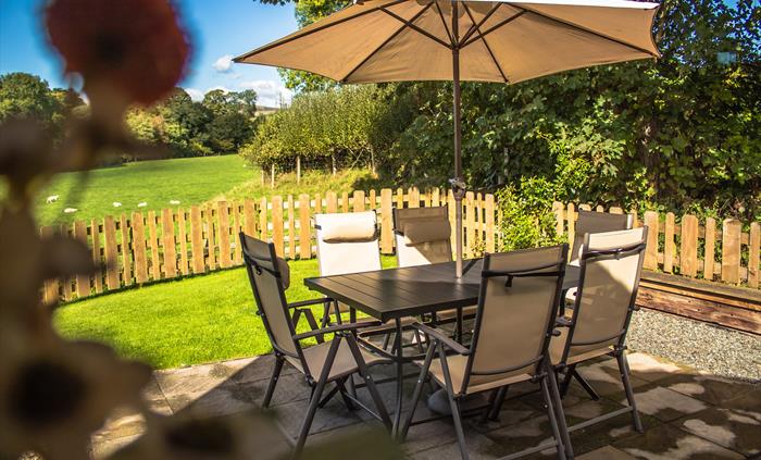 Relax on your private patio overlooking the fields and the countryside views.